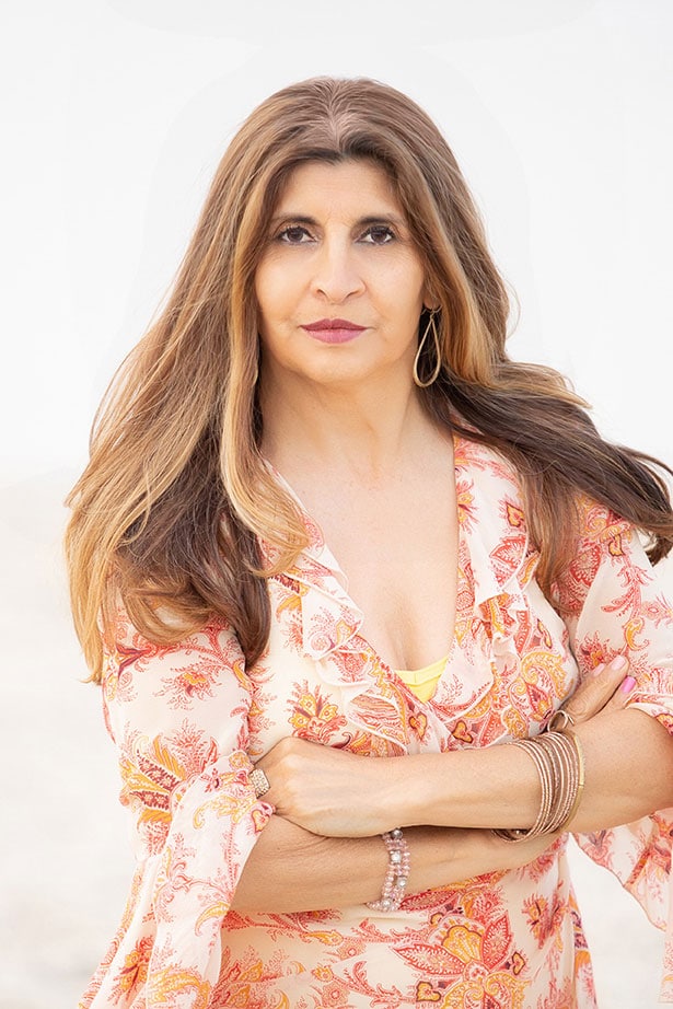 Headshot of a woman with her arms crossed