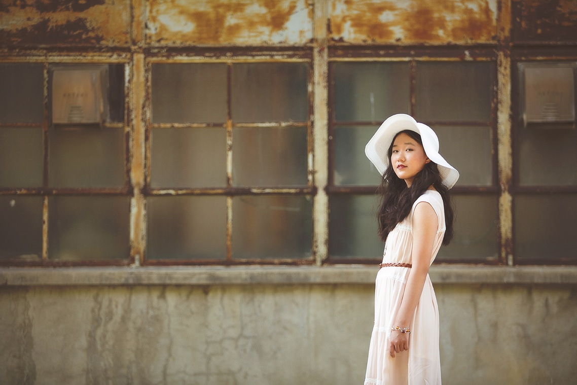 Young woman wearing a white hat